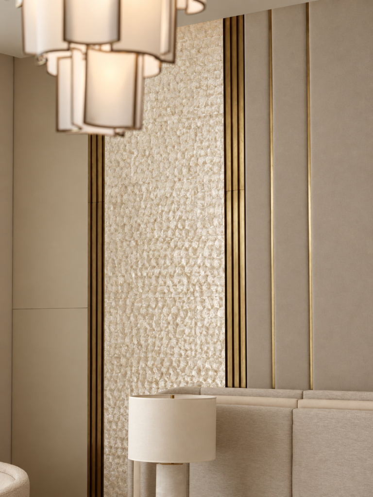 Luxury interior wall paneling featuring textured stone, brass inlay, and oak veneer details in a private residence.