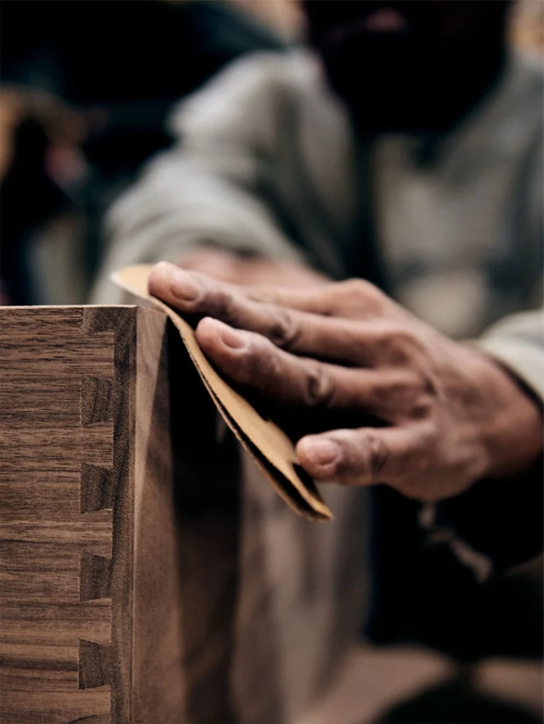Craftsman shaping a curved bentwood chair component